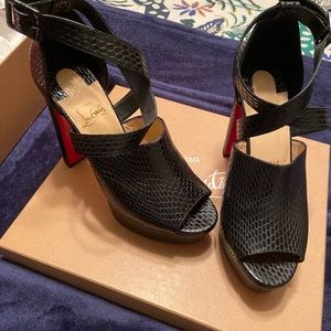Christian Louboutin/ Red Bottom size 8.5 wore once. Platform 4 inches